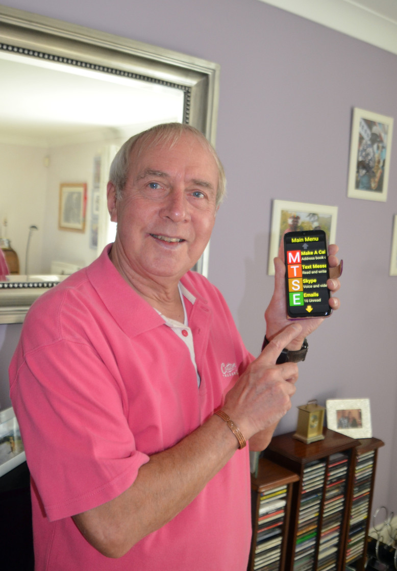 Photo of Eric with his Synapptic phone