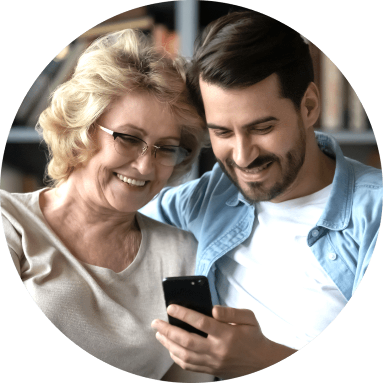 Image of two people looking at a phone