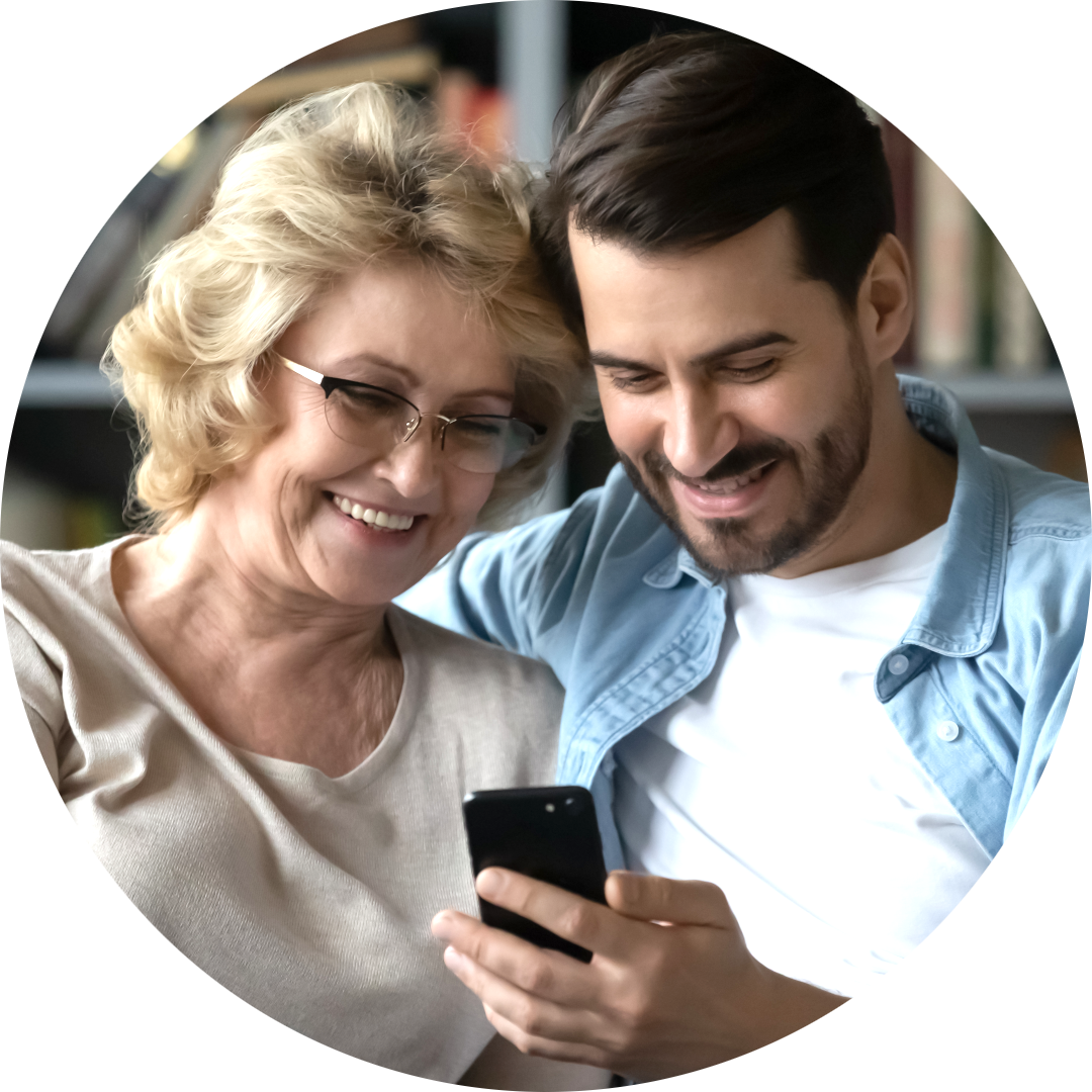 Image of two people looking at a phone